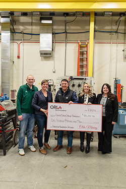 Orla and GBC members pose for a donation photo.